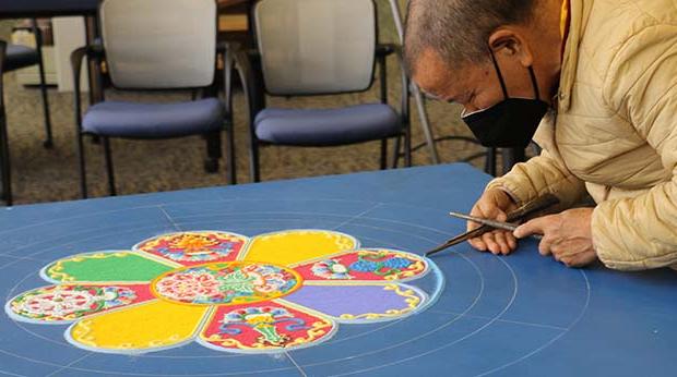 Lama Tenzin creating mandala 2022